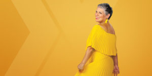 Apex Blog - Woman wearing a yellow/gold dress against a yellow gold background