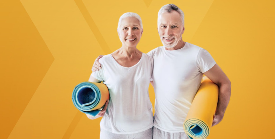 Couple poses with yoga mats ready to use their wellness benefits