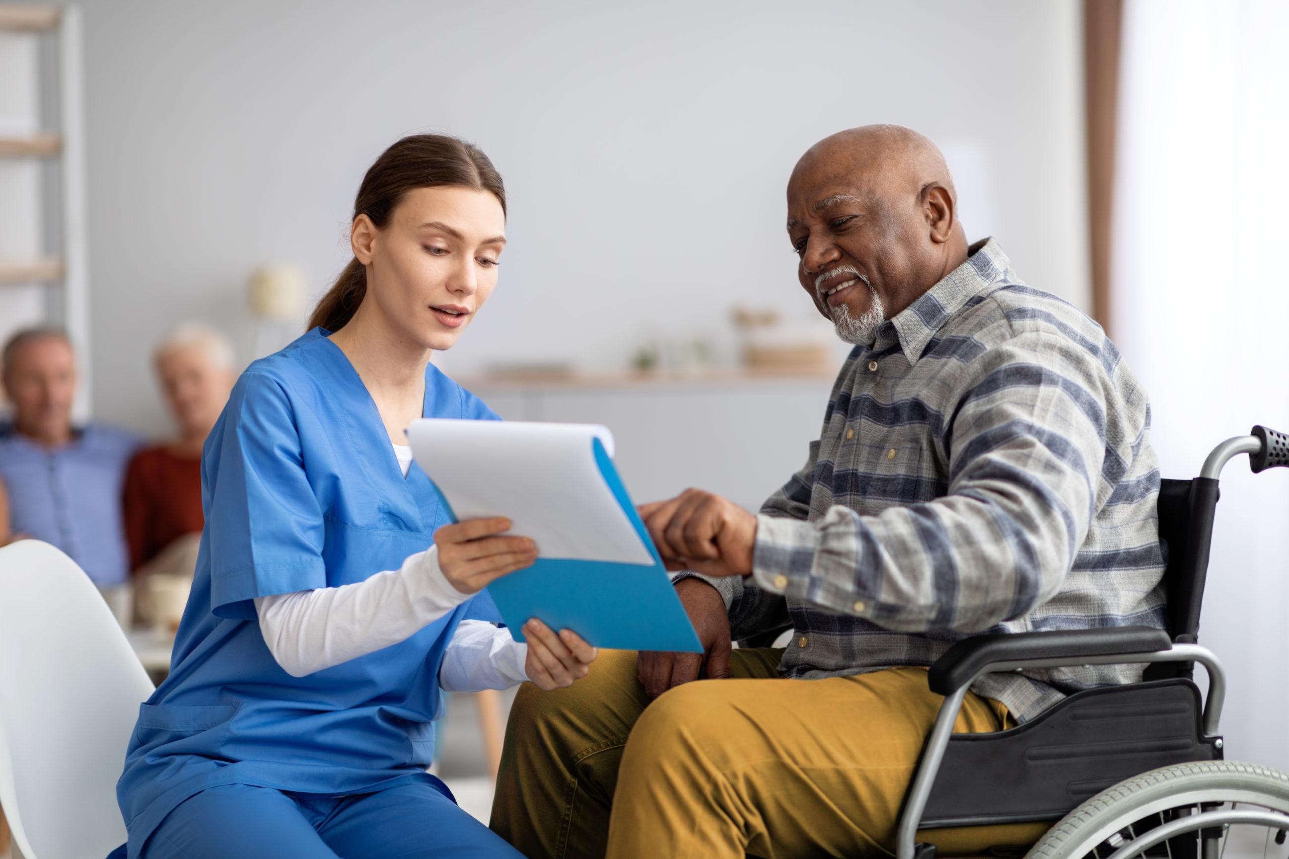 Nurse explaining diagnosis to older man